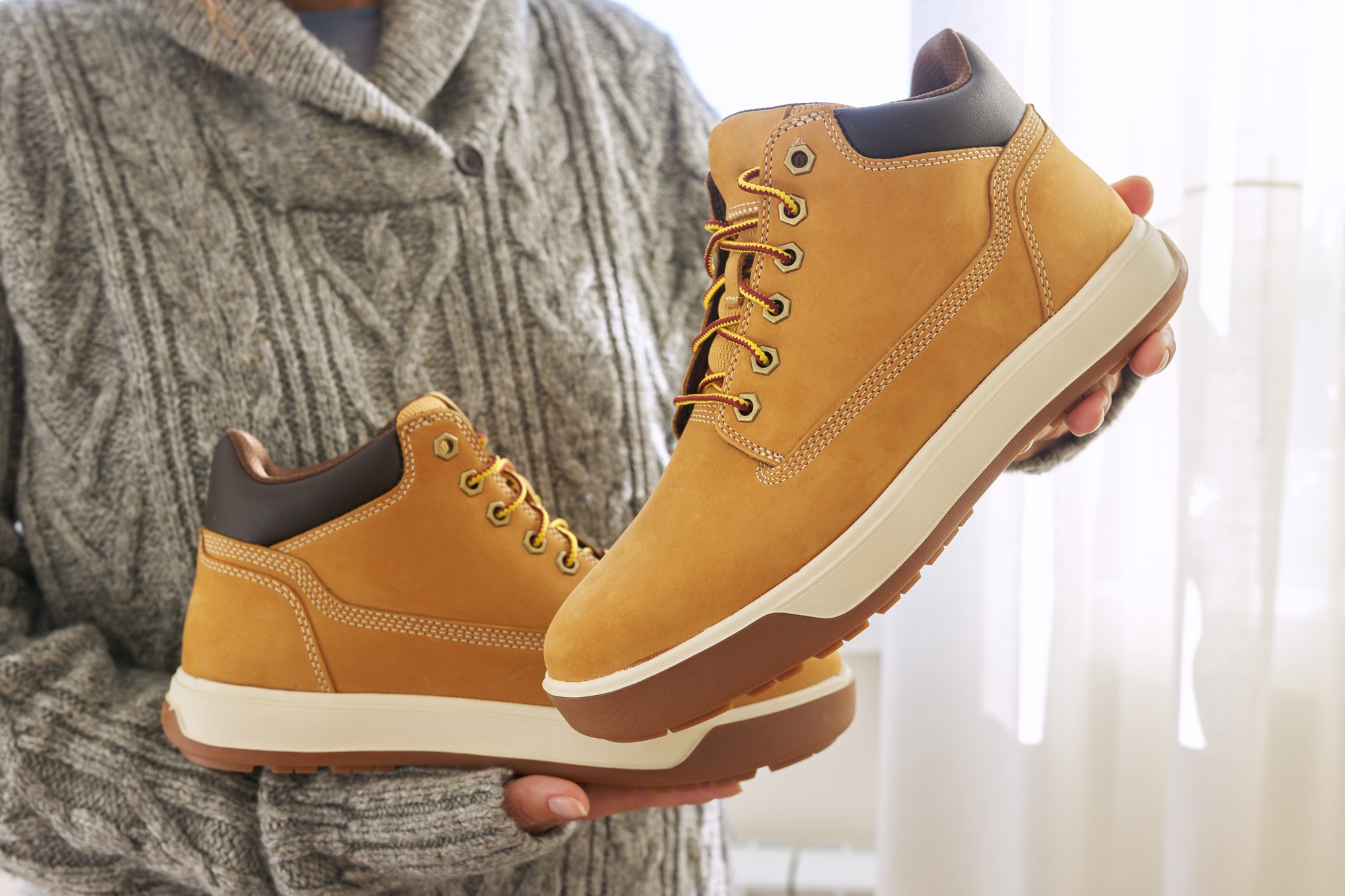 New mens leather brown waterproof winter autumn boots in hands
