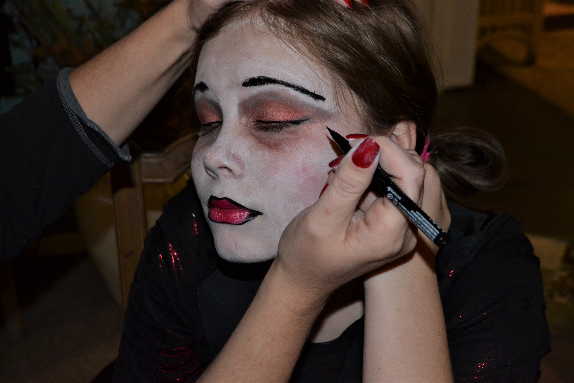 Applying Halloween makeup